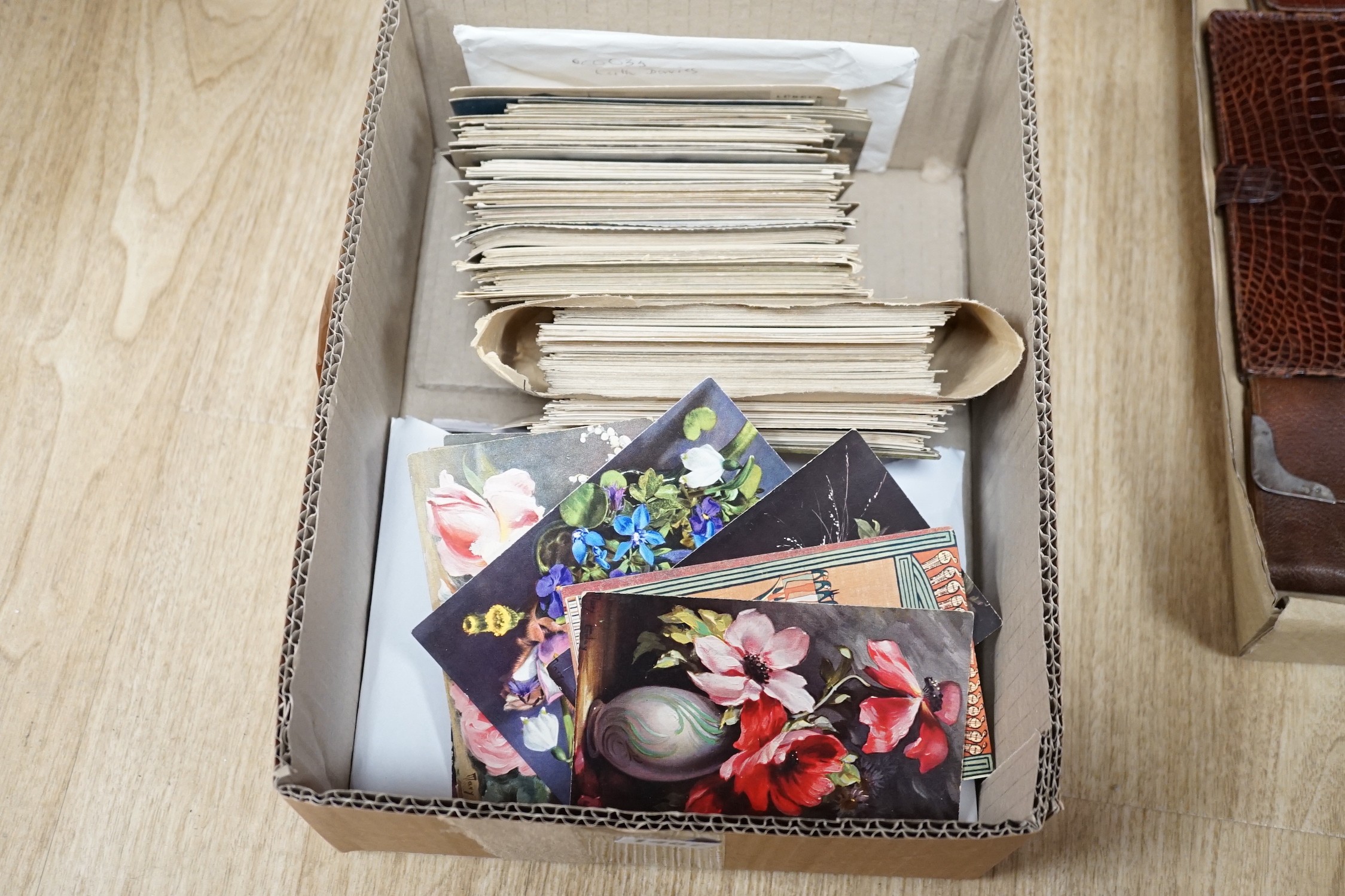 A collection of postcards including four hand-painted